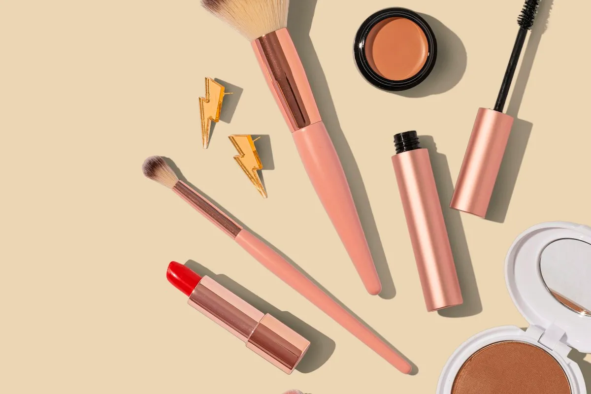 Makeup brushes and cosmetics arranged neatly