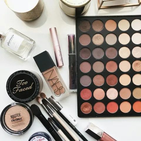 Cosmetics laid out in an organized flat arrangement